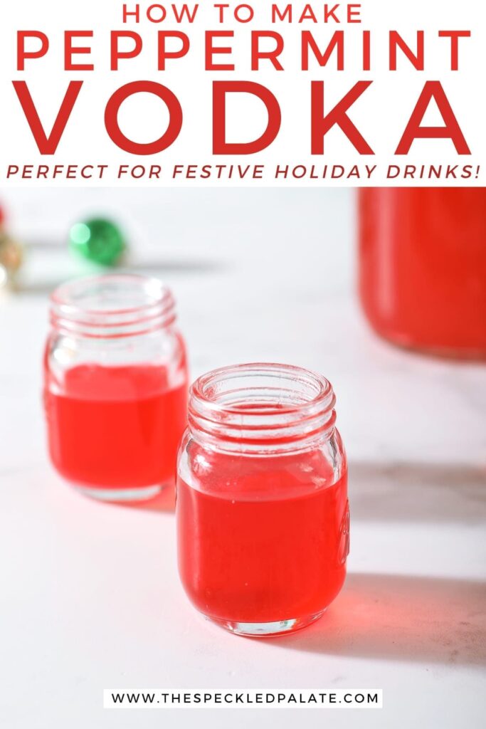 Two shot glasses of peppermint vodka on a marble surface next to a mason jar full of the candy cane-infused vodka with the text 'how to make peppermint vodka. perfect for festive holiday drinks!'