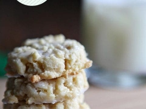 Stack of shortbread cookies with glass of milk