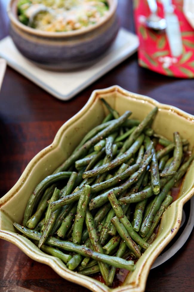 Roasted green beans in a yellow dish