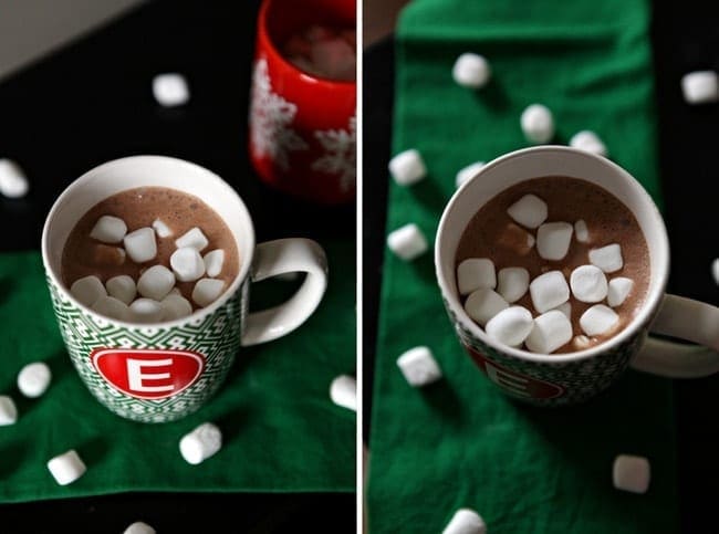 Mini marshmallows in a mug of hot cocoa on green linens