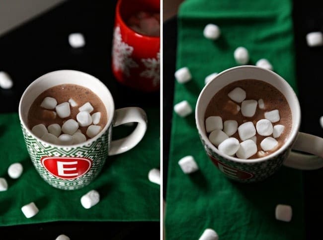 Mini marshmallows in a mug of hot cocoa on green linens 