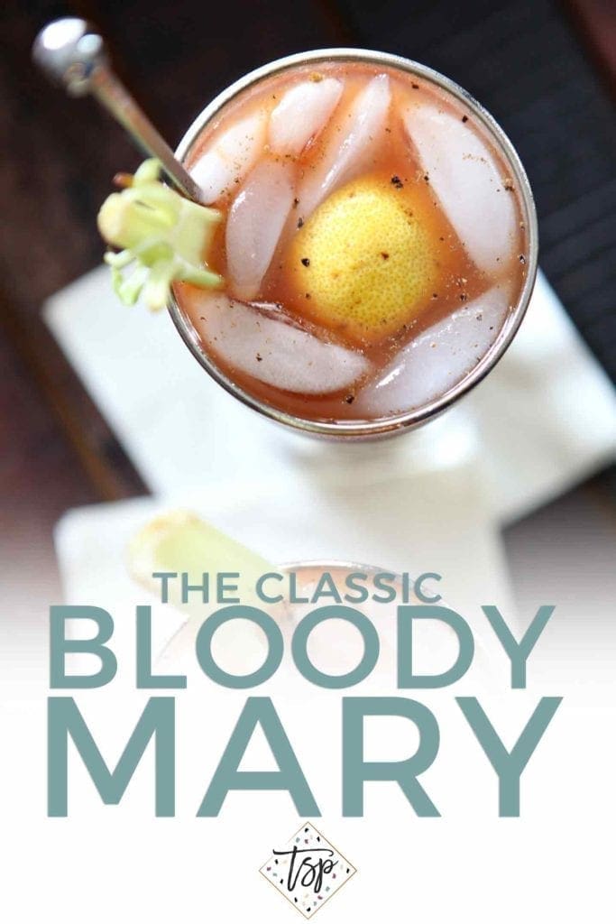 Pinterest image of Bloody Mary, featuring an overhead close up of the drink and text.