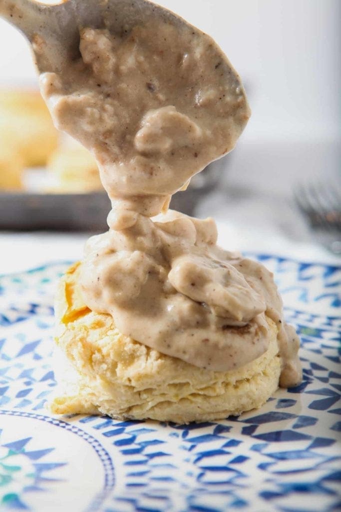 Cream Biscuits are topped with decadent White Sausage Gravy