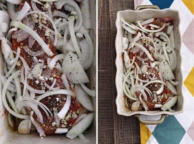 Overhead view of food with onions on top in white dish 