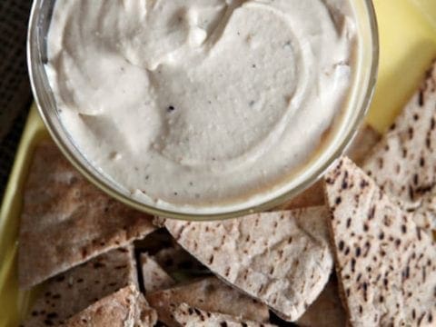Creamy, garlicky and nutty hummus is perfect for dipping vegetables and chips. Roasted Garlic and White Bean Hummus is the ultimate gameday appetizer!