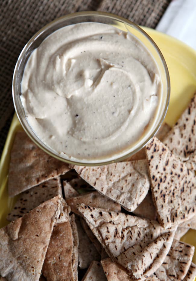 Creamy, garlicky and nutty hummus is perfect for dipping vegetables and chips. Roasted Garlic and White Bean Hummus is the ultimate gameday appetizer!