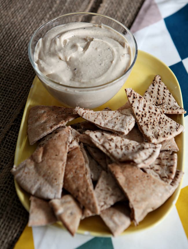 Creamy, garlicky and nutty hummus is perfect for dipping vegetables and chips. Roasted Garlic and White Bean Hummus is the ultimate gameday appetizer!