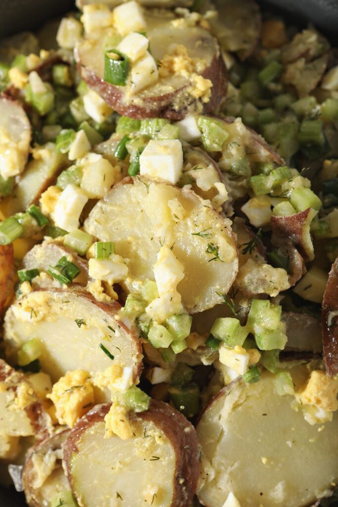 No Mayo Potato Salad with eggs, celery and dill in a bowl