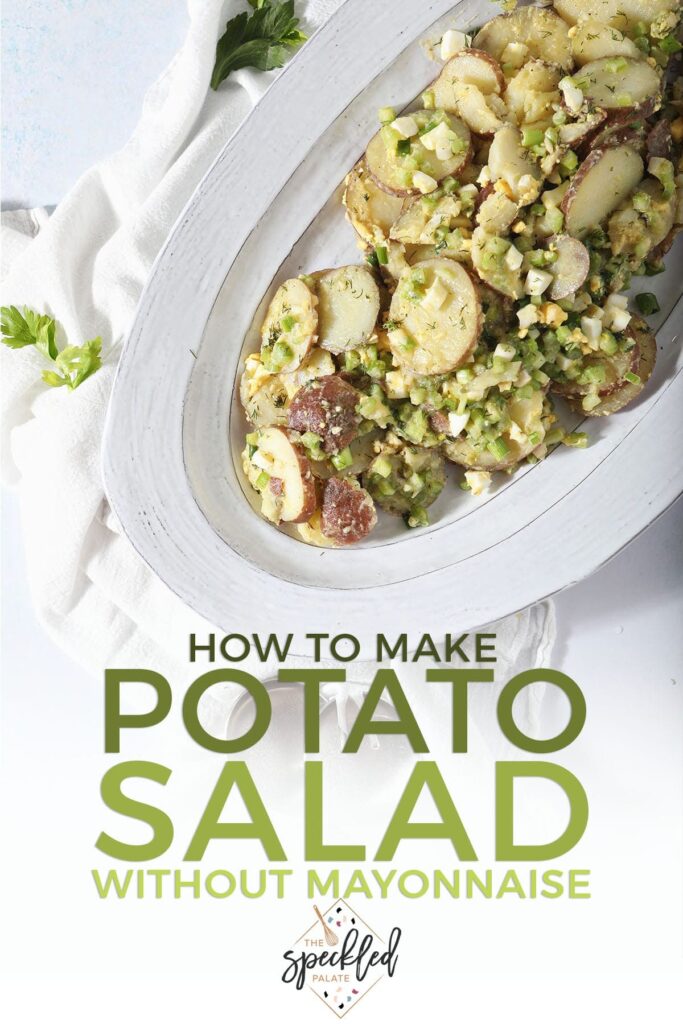 A platter of potato salad with salad tossers with the text how to make potato salad without mayonnaise