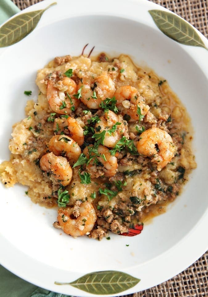 Close up of Cajun shrimp and grits recipe in a white bowl