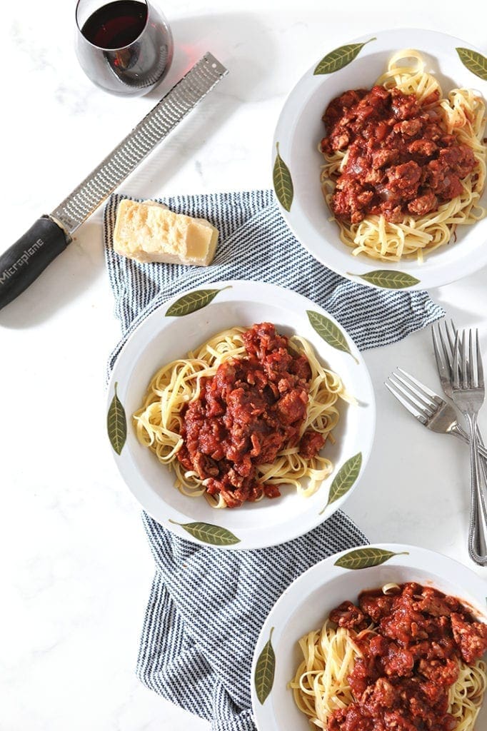 Three bowls of pasta, from above, before they have parmesan added