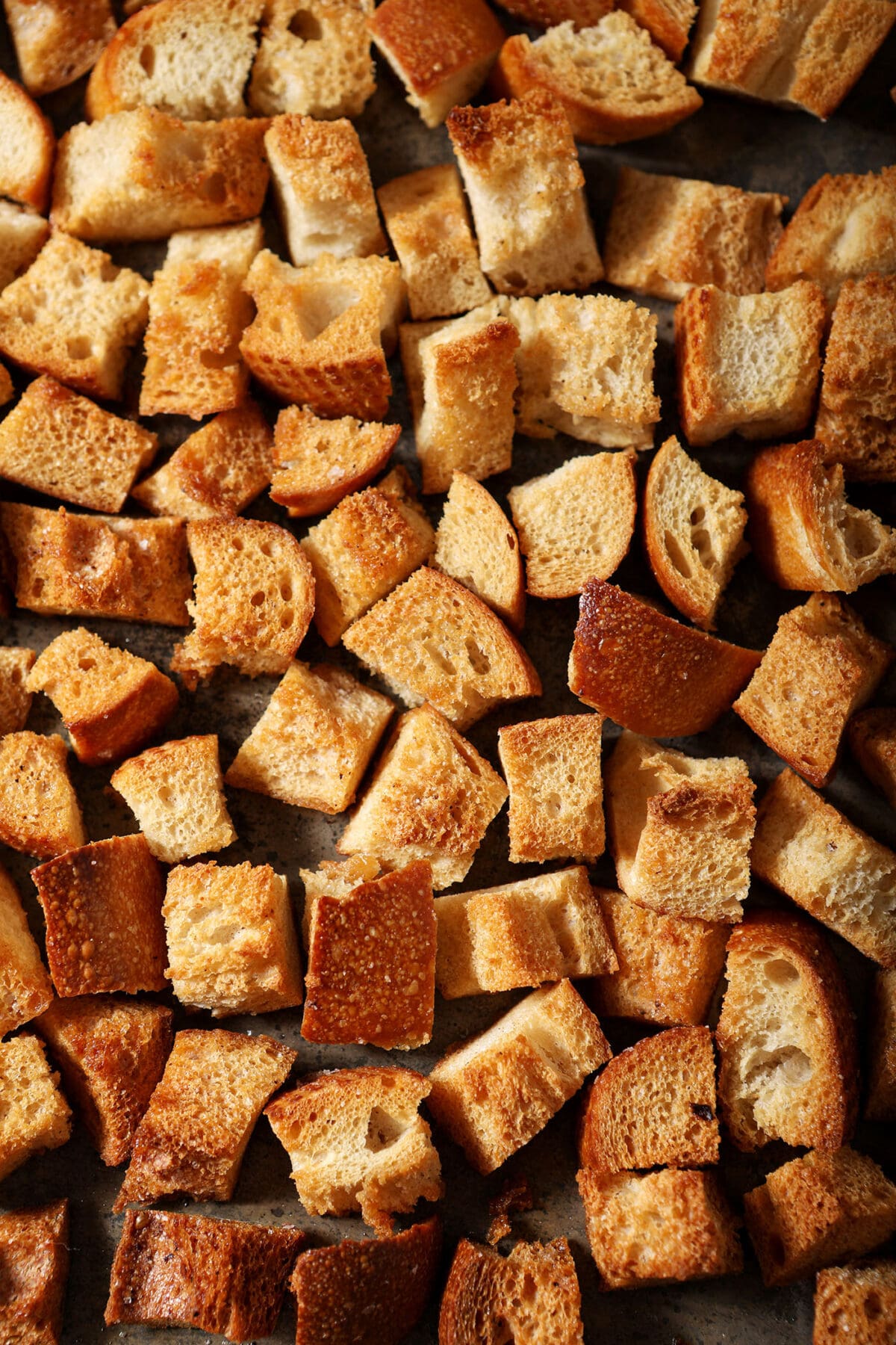 homemade croutons on a sheet pan after baking