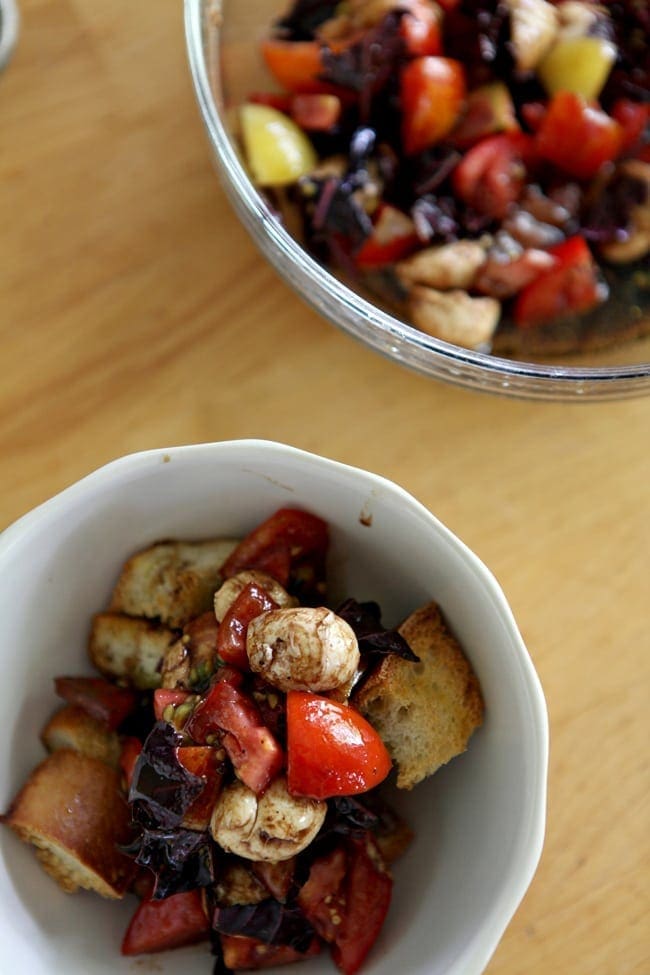 Overhead close up of Heirloom Caprese Panzanella Salad in bowls 