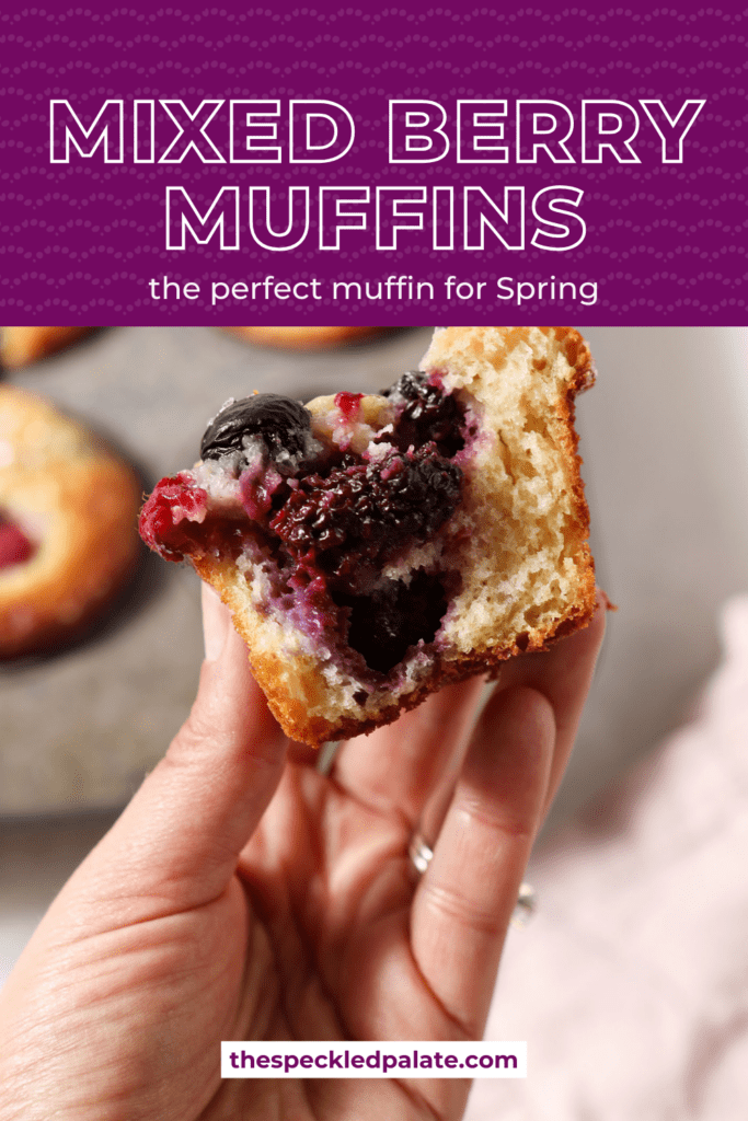 A bitten-into berry muffin held in a hand with the text mixed berry muffins the perfect muffin for spring