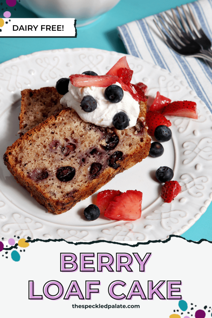 Two slices of blueberry cake on a plate with whipped cream, blueberries and strawberry slivers with the text Berry Loaf Cake