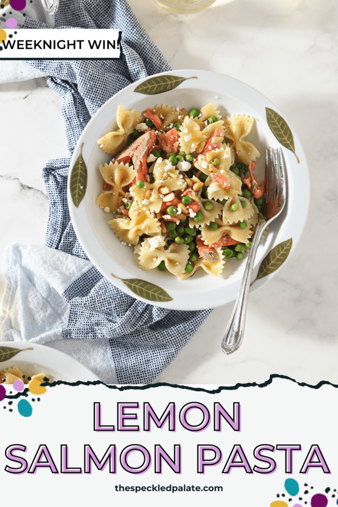 A bowl of pasta with lemons and salmon with the text Lemon Salmon Pasta