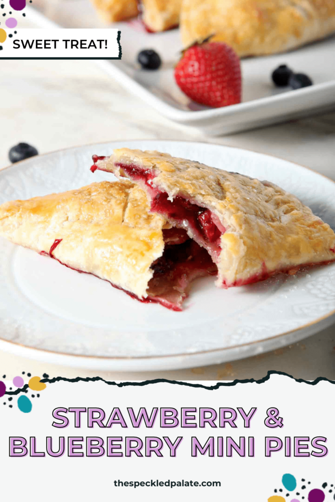 Close up of a halved hand pie, with the fruit filling showing, with the text Strawberry & Blueberry Mini Pies