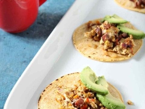 breakfast tacos on a white serving tray