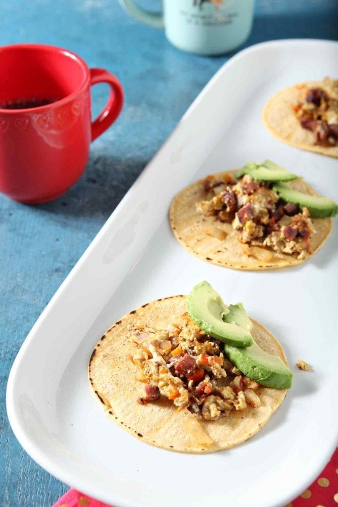 breakfast tacos on a white serving tray