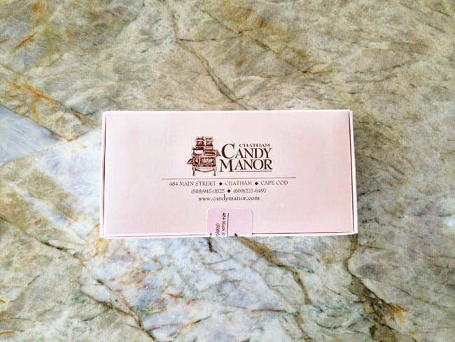 Box of candy sitting on a marble counter 