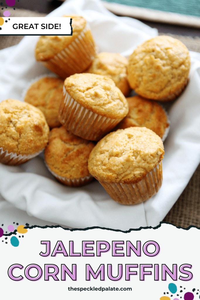 a bowl of cornbread muffins lined with a white linen with the text jalapeno corn muffins