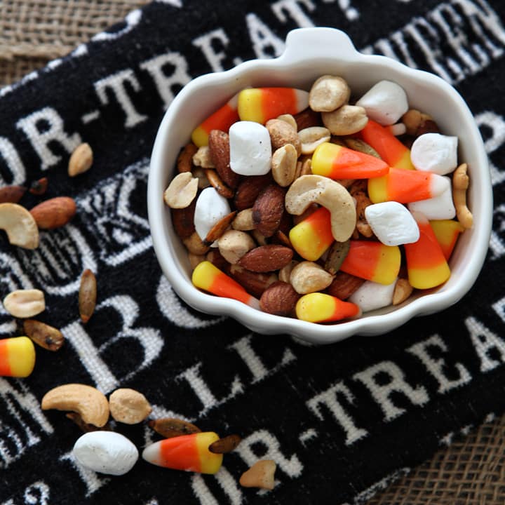 Overhead close up of Halloween Trail Mix in white pumpkin bowl