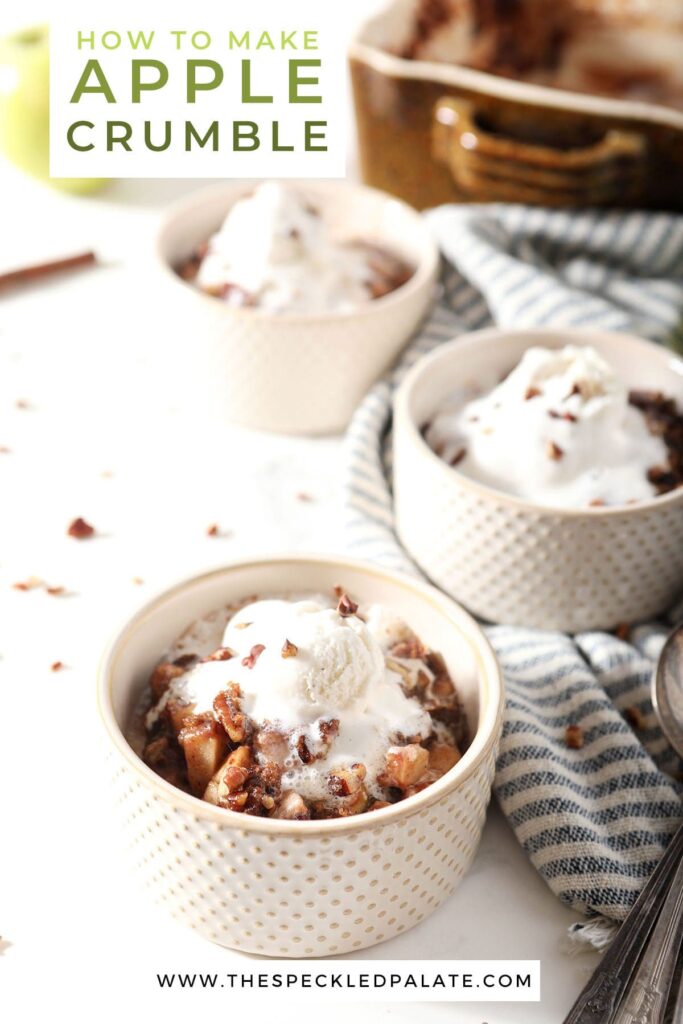 Three bowls of a hot apple dessert with ice cream on marble with the text how to make apple crumble