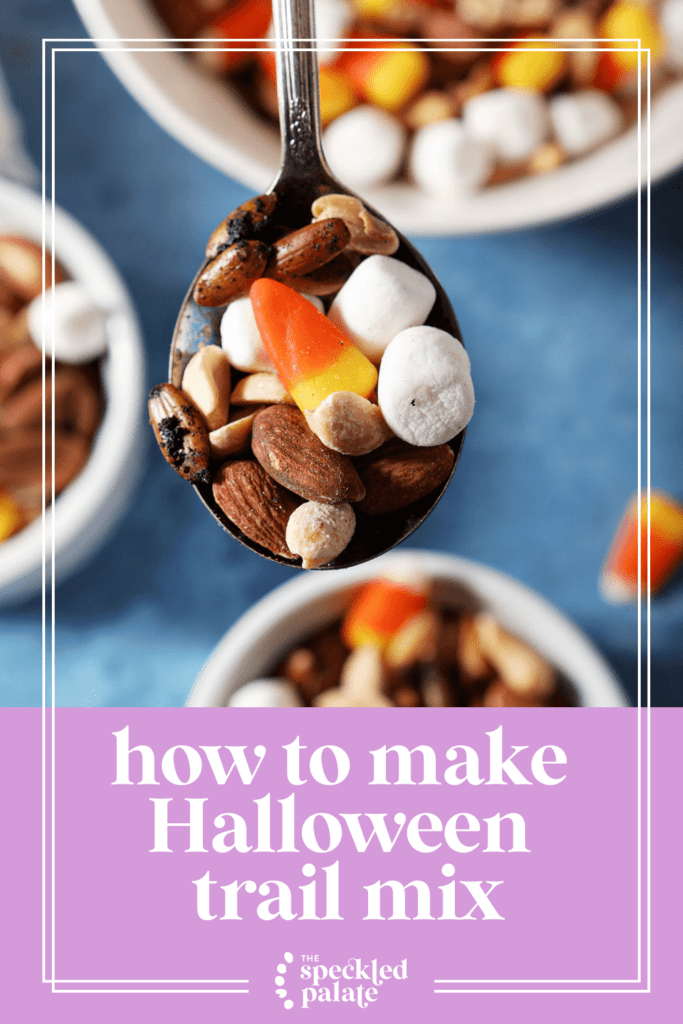 A spoon holds a bite of halloween trail mix above three smaller bowls with the text how to make halloween trail mix