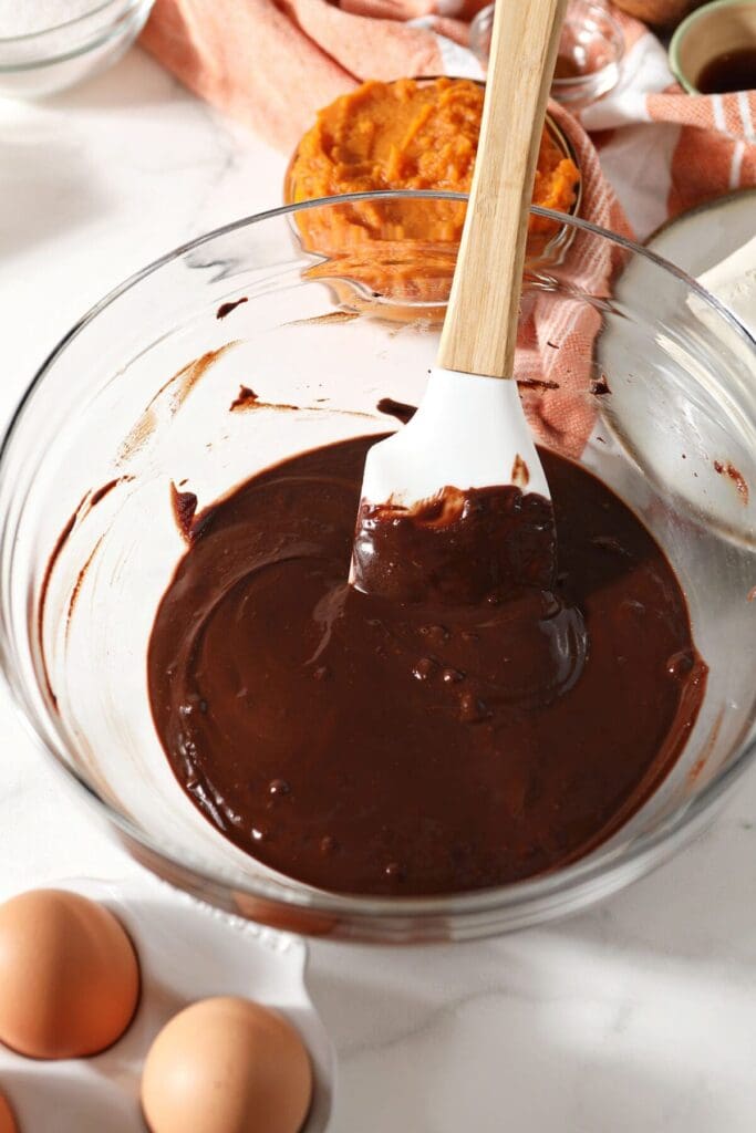 Chocolate chips and chocolate bars and butter in a bowl after melting