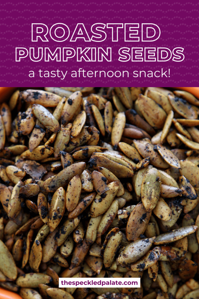 Close up of roasted pumpkin seeds with the text roasted pumpkin seeds a tasty afternoon snack