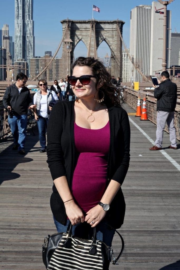 A woman with sunglasses posing for the camera 