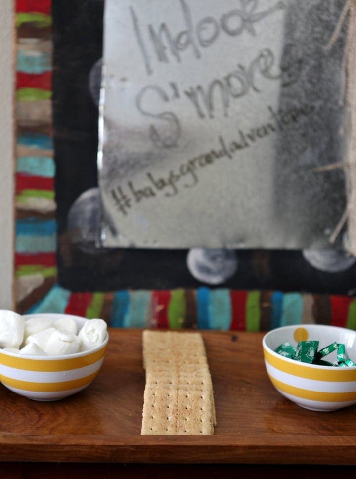 Two bowls filled with ingredients next to graham crackers 