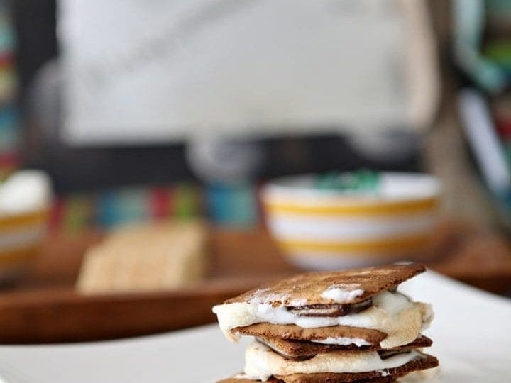 Stack of toasted s'mores on white dish