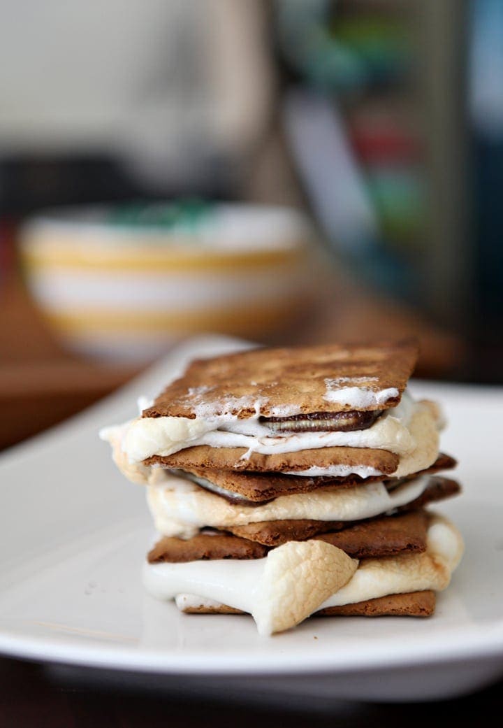 Close up of stacked toasted s'mores on plate 