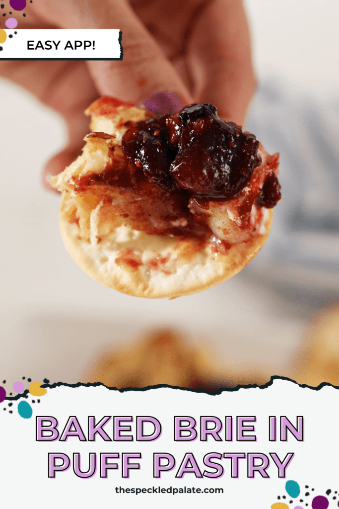 A hand holds a cracker slathered with Brie and cranberry chutney with the text Baked Brie in puff pastry