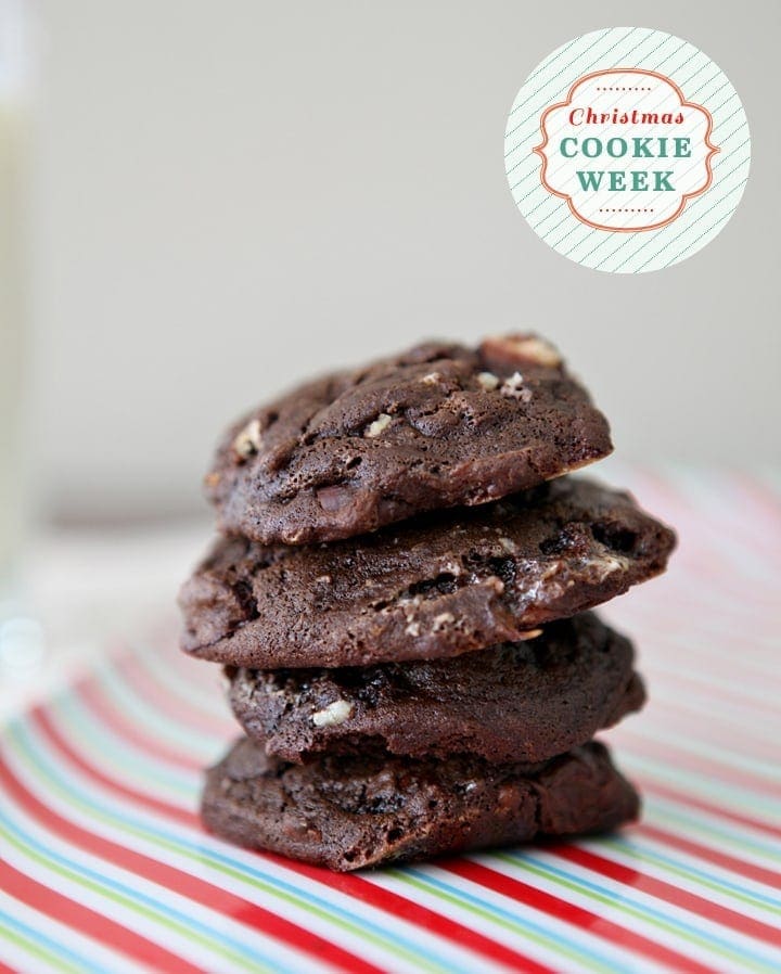 A stack of Chocolate Marshmallow Cookies with Pecans on a green, red and white striped platter