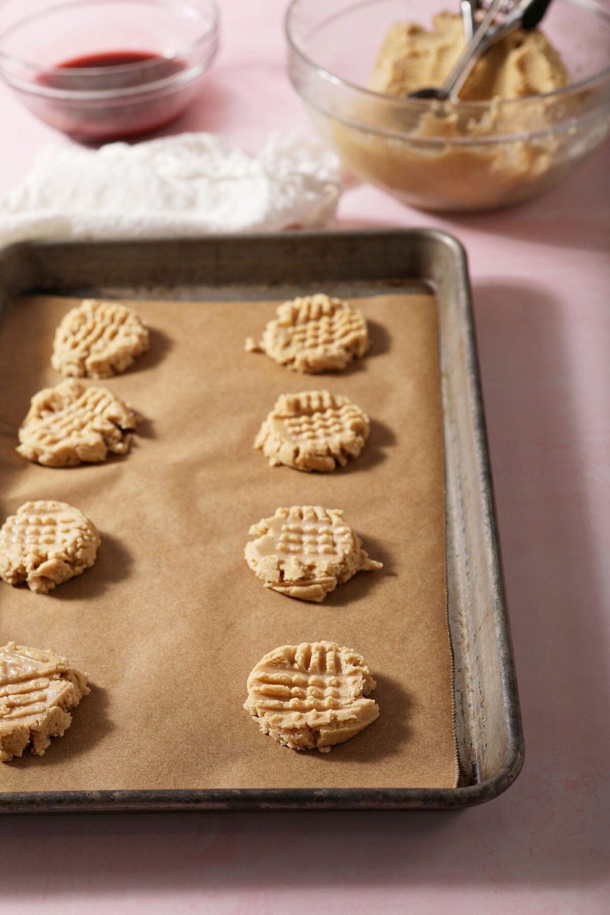 Formed shortbread cookie dough on a sheet pan before baking