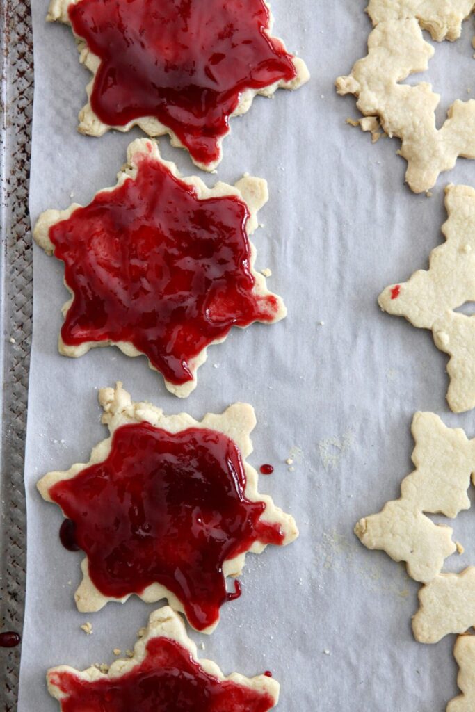 Raspberry jam on snowflake cookies