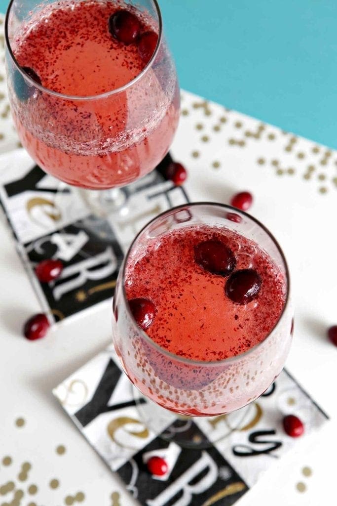 Overhead view of Two Cranberry Sparkler Mocktails on napkins