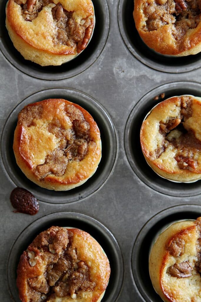 Overhead image of just-baked Coffee Cake Muffins in the muffin tin