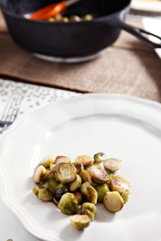 A large serving of Roasted Lemon Brussels Sprouts on a white plate