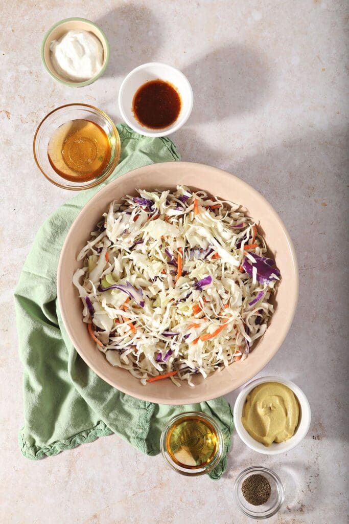 Mustard coleslaw ingredients in bowls