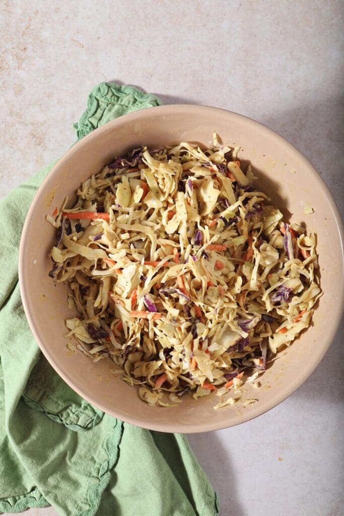 Mustard coleslaw, after mixing, in a bowl