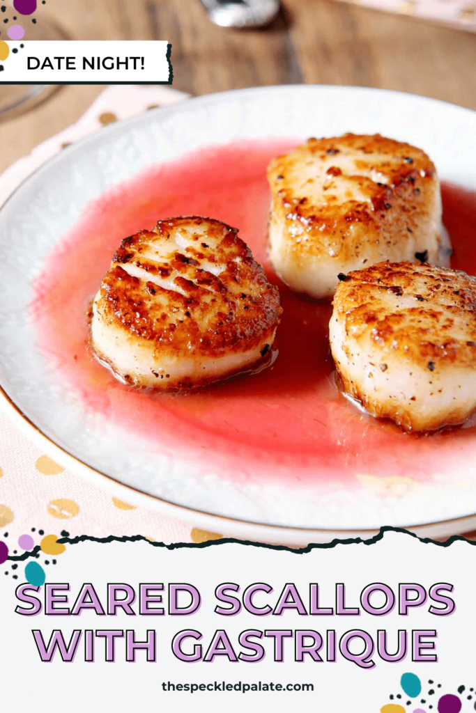 Closeup of three scallops on a plate in a pink sauce with the text Seared Scallops with Gastrique