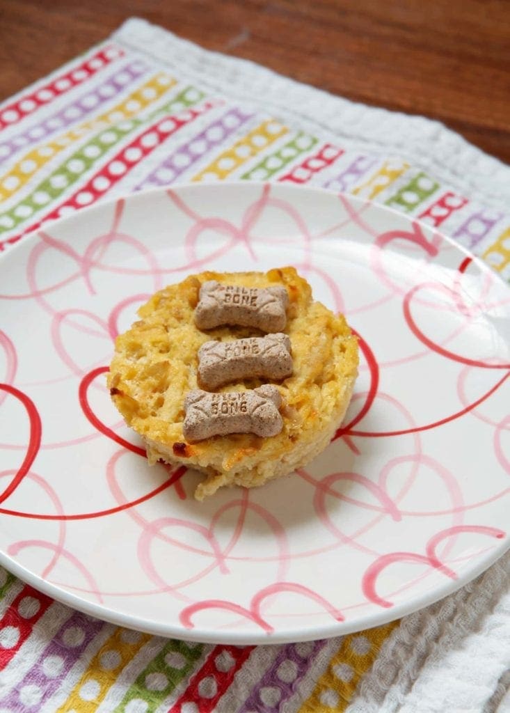 Pupcake on plate with red hearts 