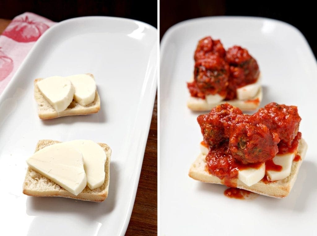 White plate with sliced open meatball subs 