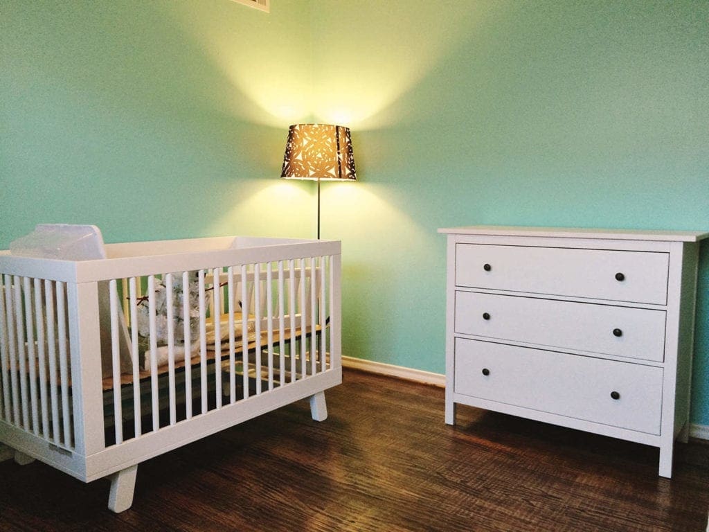 Crib and dresser in a nursery 