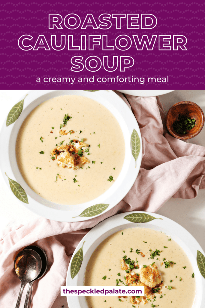 Three white bowls of cauliflower soup garnished with roasted cauliflower and parsley with a pink linen and spoons with the text roasted cauliflower soup a creamy and comforting meal