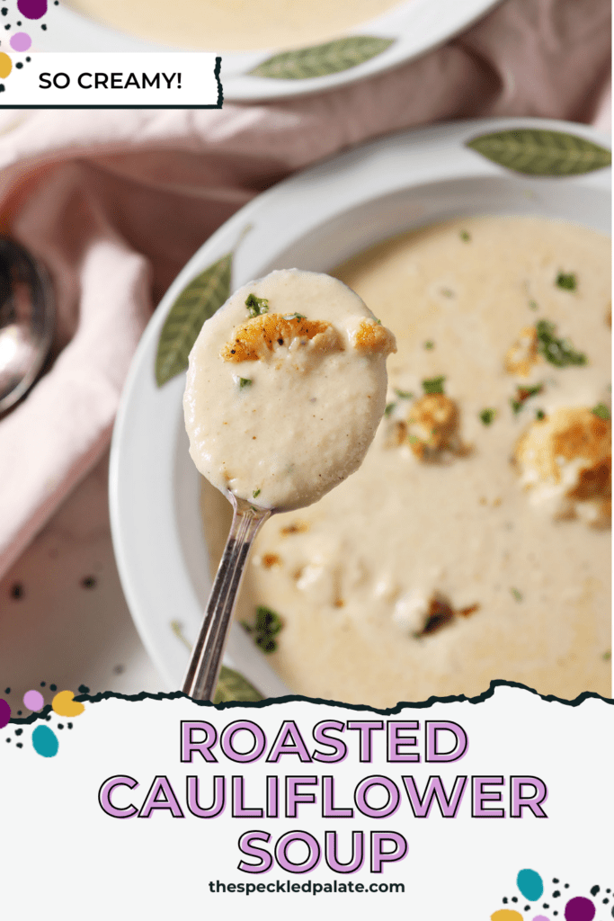 A spoon holds a bite of cauliflower soup above a bowl of it with the text roasted cauliflower soup