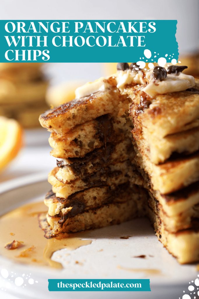 Close up of the inside of a stack of Pancakes with Chocolate Chips on a plate with the text orange pancakes with chocolate chips